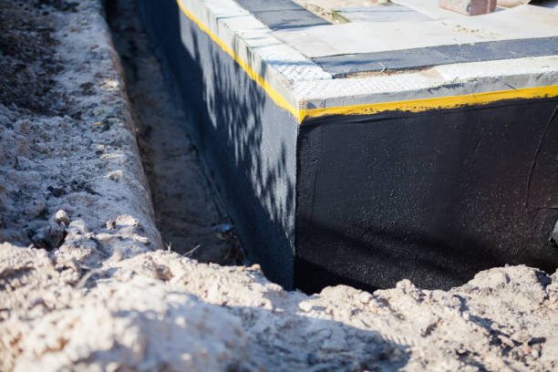 Professional Basement Waterproofing technician working in Freehold, NJ